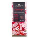 Valrhona Guanaja 70% dark chocolate bar, 70g, in pink and red cocoa pod packaging with black label.