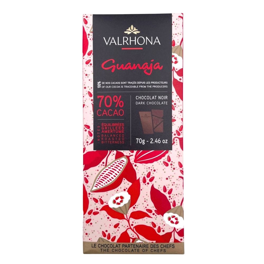 Valrhona Guanaja 70% dark chocolate bar, 70g, in pink and red cocoa pod packaging with black label.