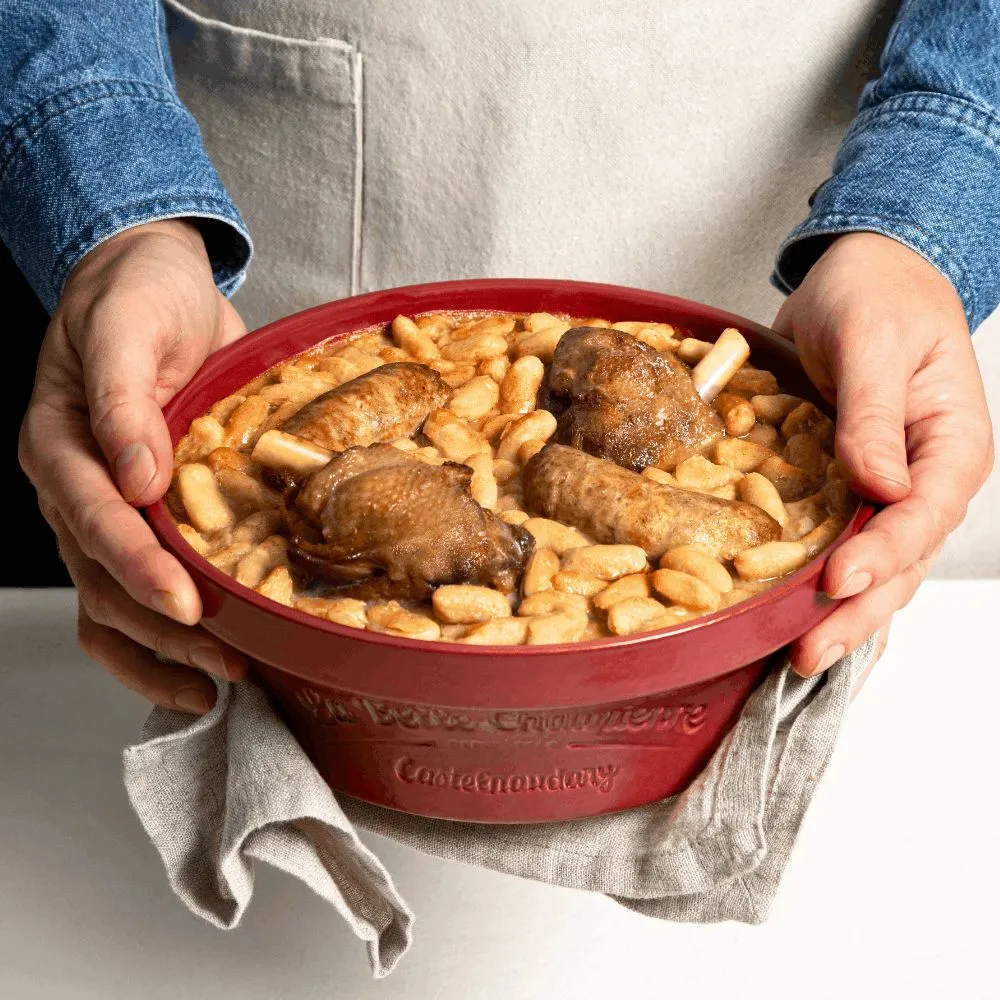Casoulet dish with beans and confit duck in a large dish, a typical bistrot meal.