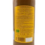 Back view of a 750 ml bottle of Alain Milliat Organic Ginger Concentrate, showing the ingredients, preparation instructions, and product information on a white background.