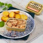Ferrigno Wild Salmon in Spring Water shown in an open tin with toasted bread