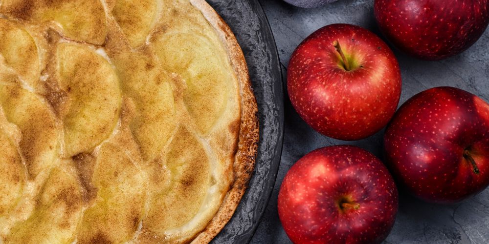 Apple Flammekueche with thinly sliced apples and cinnamon, a sweet Alsatian dessert