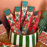 Maison Pécou Casse Noisette chocolate and nut selection gift boxes arranged in a decorative bowl.
